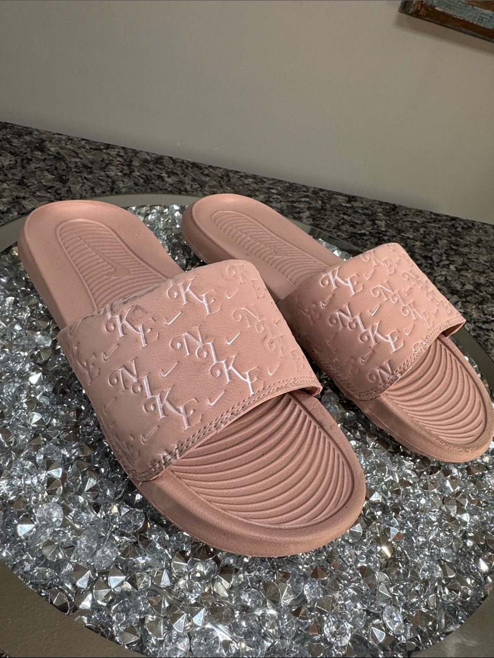Nike Women's Pale Pink Embossed Logo Slide Sandals 8